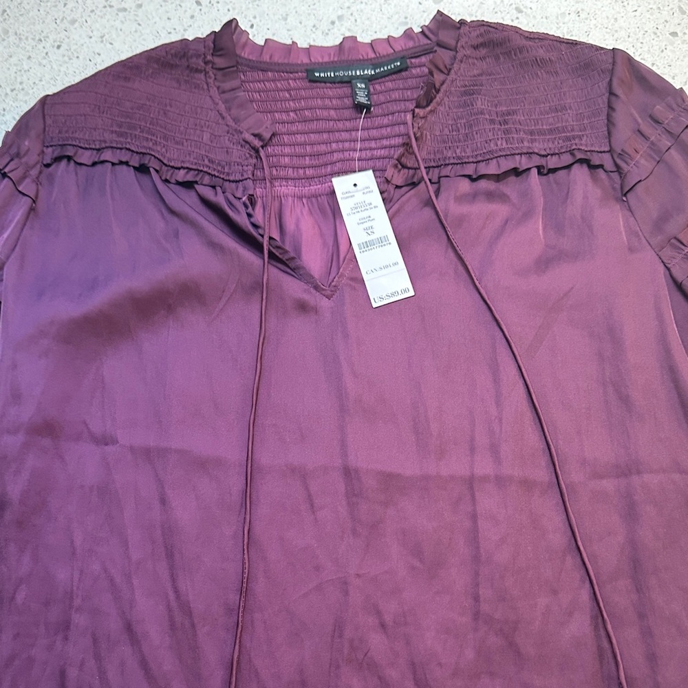 White House Black Market Plum Blouse with tie neck. Size XS